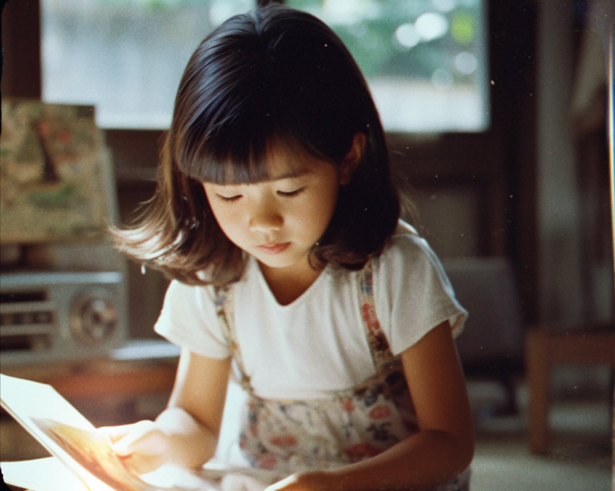 A child reading by the window